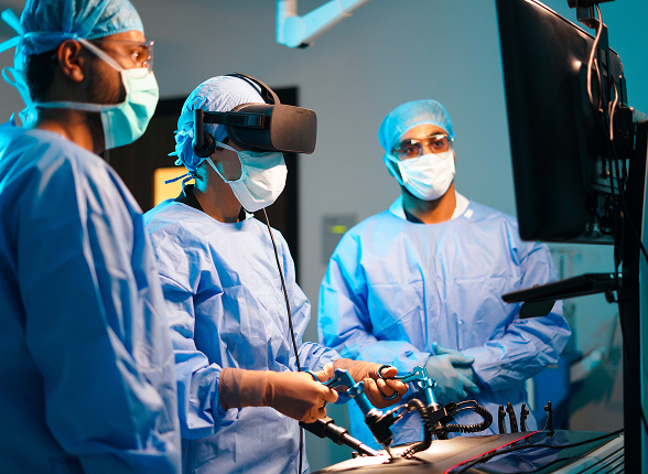 A team of surgeons performing an operation under surgical lights