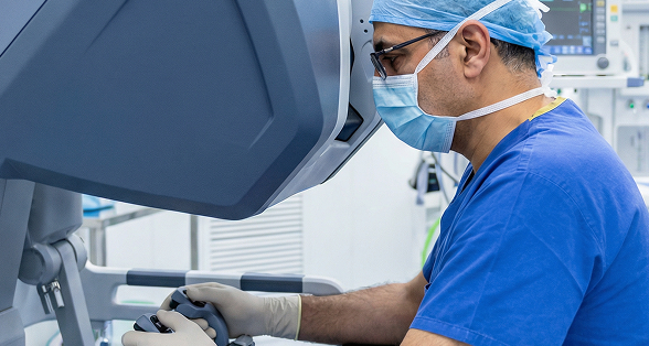 Dr. Feras performing a robotic surgery