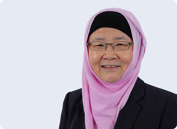 A team of surgeons performing an operation under surgical lights