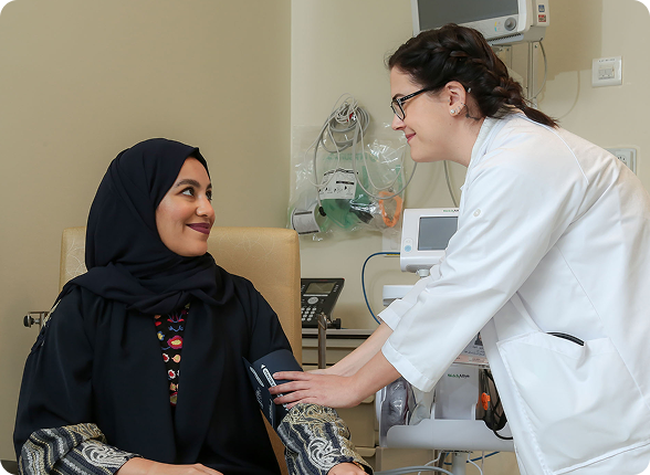 A team of surgeons performing an operation under surgical lights
